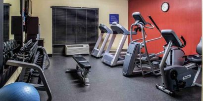 Fitness center with treadmills and machines at the Hampton Inn Albuquerque, University-Midtown (UNM).