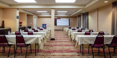 Large meeting room with tables and chairs at the Hampton Inn Albuquerque, University-Midtown (UNM).