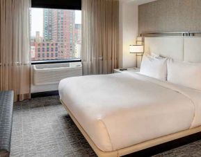 relaxing delux king room with TV at DoubleTree by Hilton Hotel & Suites Jersey City.