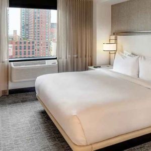 relaxing delux king room with TV at DoubleTree by Hilton Hotel & Suites Jersey City.