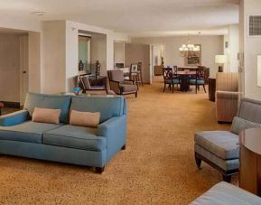 Spacious living room in a presidential suite perfect as workspace at the DoubleTree by Hilton Tulsa-Downtown.