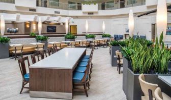Comfortable lobby lounge area ideal as a coworking space at Embassy Suites by Hilton Seattle Tacoma International Airport.