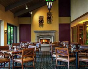 Dining area by the fireplace perfect for co-working at the DoubleTree by Hilton Sonoma Wine Country.