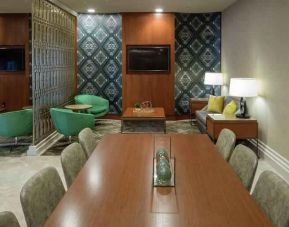 Comfortable hotel workspace with tables and lounges at the Hilton Birmingham at UAB.