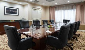 Elegant meeting room with comfortable chairs at the DoubleTree Suites by Hilton Cincinnati-Blue Ash.