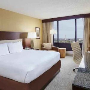Comfortable king size bed in a hotel guestroom at the DoubleTree by Hilton Washington DC - Crystal City.