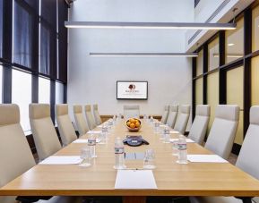 Small meeting room with TV screen at the DoubleTree by Hilton Washington DC - Crystal City.