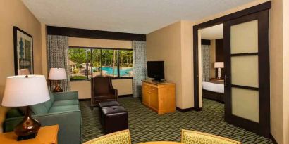 Spacious living room with working station at the DoubleTree Suites by Hilton Orlando - Disney Springs Area.