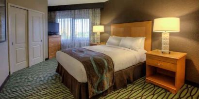 Queen suite with window at the DoubleTree Suites by Hilton Orlando - Disney Springs Area.