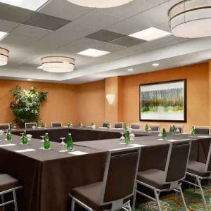 Meeting room with square conference table at the DoubleTree Suites by Hilton Orlando - Disney Springs Area.