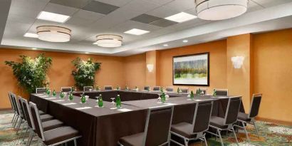 Meeting room with square conference table at the DoubleTree Suites by Hilton Orlando - Disney Springs Area.