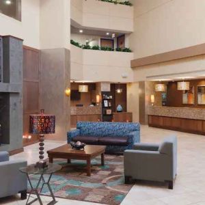 Comfortable lobby workspace with sofas at the DoubleTree Suites by Hilton Orlando - Disney Springs Area.