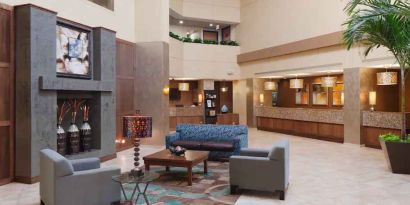 Comfortable lobby workspace with sofas at the DoubleTree Suites by Hilton Orlando - Disney Springs Area.