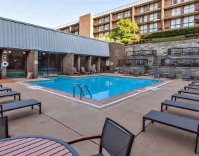 Outdoor pool with lounges at the DoubleTree by Hilton Pittsburgh Green Tree.