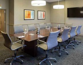 Small meeting room with TV screen at the DoubleTree by Hilton Pittsburgh Green Tree.