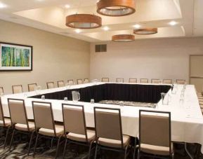 Meeting room with square conference table at the Embassy Suites by Hilton Cincinnati Blue Ash.