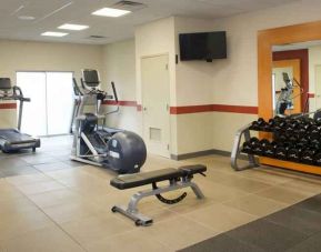 Fitness center with weights at the Embassy Suites by Hilton Cincinnati Blue Ash.