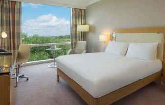 Bright king bedroom with view at the Hilton Reading.