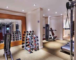 Fitness center with weights and mirror at the DoubleTree by Hilton London - Ealing.