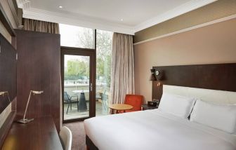 King bedroom with balcony at the DoubleTree by Hilton London - Hyde Park.
