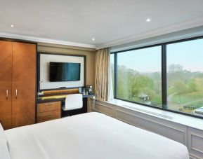 King guestroom with window and desk at the DoubleTree by Hilton London - Hyde Park.