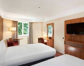 Twin room with TV screen and working station at the DoubleTree by Hilton Newbury North.