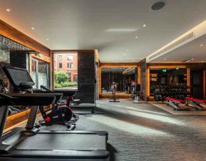 Fully equipped fitness center at the Fellows House Cambridge, Curio Collection by Hilton.