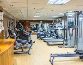 Fitness center with machines at the Hilton London Kensington.
