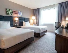 Comfortable twin room with working station at the Hilton Garden Inn Birmingham Airport UK.