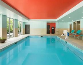 Indoor pool with pool chairs at the Homewood Suite by Hilton Atlanta Perimeter.
