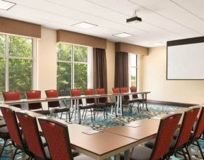 Meeting room with projector board for board meetings at the Homewood Suite by Hilton Atlanta Perimeter.