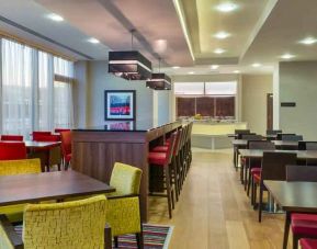 Dining area perfect for co-working at the Hampton by Hilton London Luton Airport.