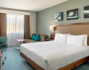 comfortable delux king room with TV and work desk ideal for working remotely at Hilton Garden Inn London Heathrow Airport.
