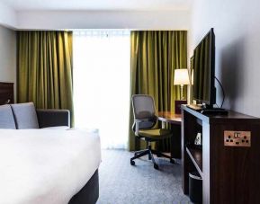 spacious king room with work area and lounge at Hampton by Hilton Exeter Airport.