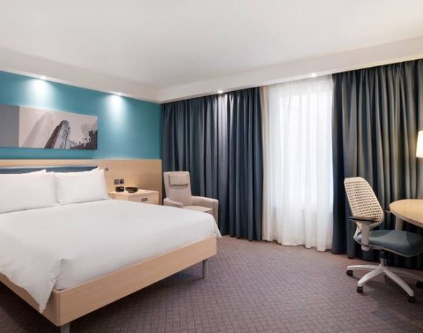 King bedroom with working station at the Hampton by Hilton Bristol Airport.