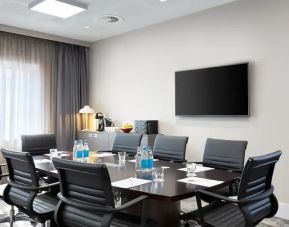 Small meeting room with TV screen at the Hampton by Hilton Bristol Airport.