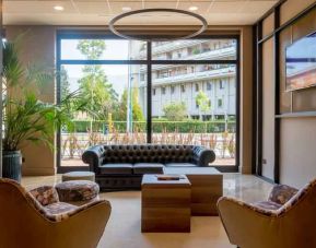 Hotel workspace with sofas at the DoubleTree by Hilton Brescia.