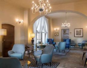 Stylish lobby workspace at the Grand Hotel Villa Torretta Milan Sesto, Curio Collection.