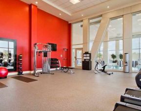 Well equipped fitness center with natural light at Homewood Suites by Hilton University City Philadelphia, PA.