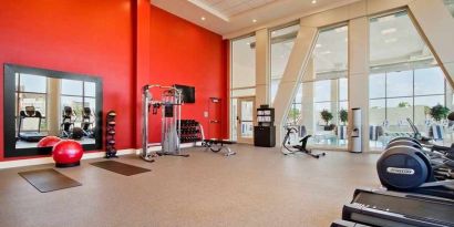 Well equipped fitness center with natural light at Homewood Suites by Hilton University City Philadelphia, PA.