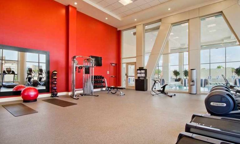 Well equipped fitness center with natural light at Homewood Suites by Hilton University City Philadelphia, PA.