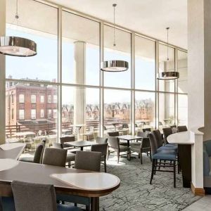 Comfortable lounge and coworking space with lots of natural light at Homewood Suites by Hilton University City Philadelphia, PA.
