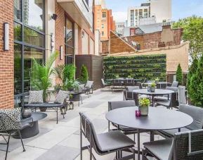 lovely outdoor patio with city scape views at Canopy by Hilton Jersey City Arts District.
