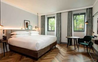 Bright king guestroom with working station at the DoubleTree by Hilton Rome Monti.