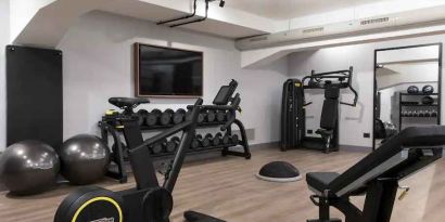 Fully equipped fitness center at the DoubleTree by Hilton Rome Monti.