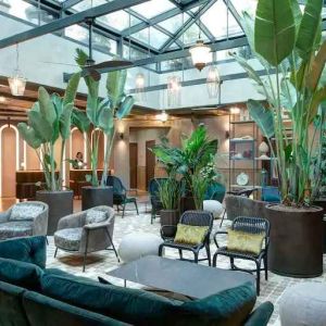 Beautiful lobby workspace with plants at the DoubleTree by Hilton Rome Monti.