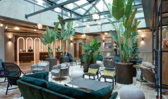 Beautiful lobby workspace with plants at the DoubleTree by Hilton Rome Monti.