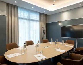 Small meeting room with round table at the DoubleTree by Hilton Rome Monti.