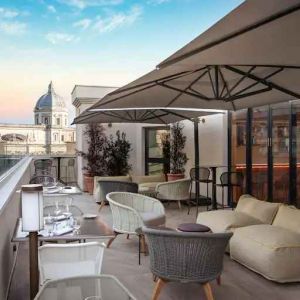 Beautiful outdoor terrace overlooking the city at the DoubleTree by Hilton Rome Monti.