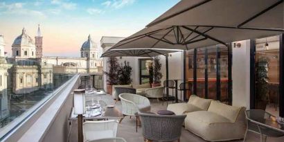Beautiful outdoor terrace overlooking the city at the DoubleTree by Hilton Rome Monti.